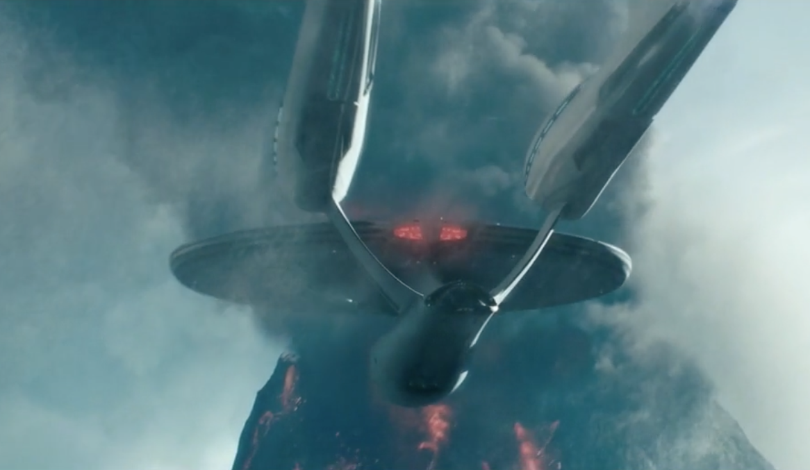 Still of a sequence from the Star Trek franchise that was created using Foundry visual effects tools. The image shows the U.S.S. Enterprise flying over an erupting volcano.