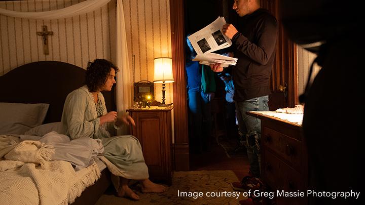 woman on bed with script