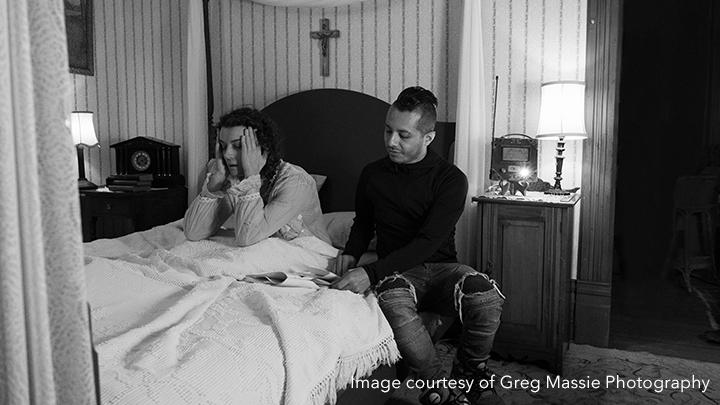 woman and director on bed with script