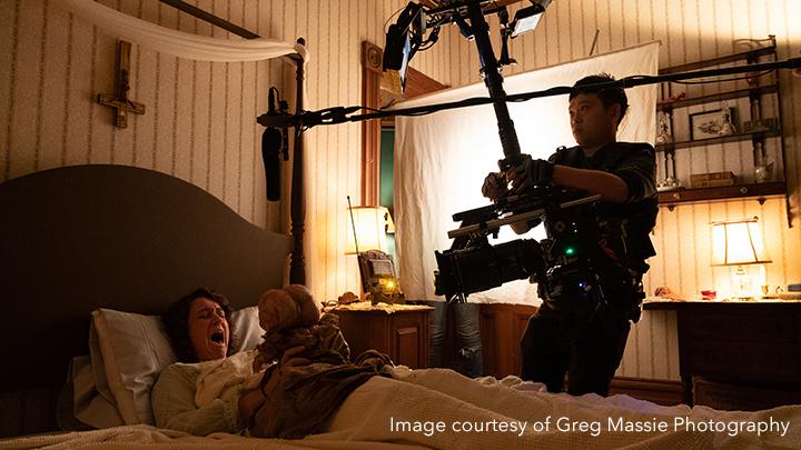 Camera man recording woman